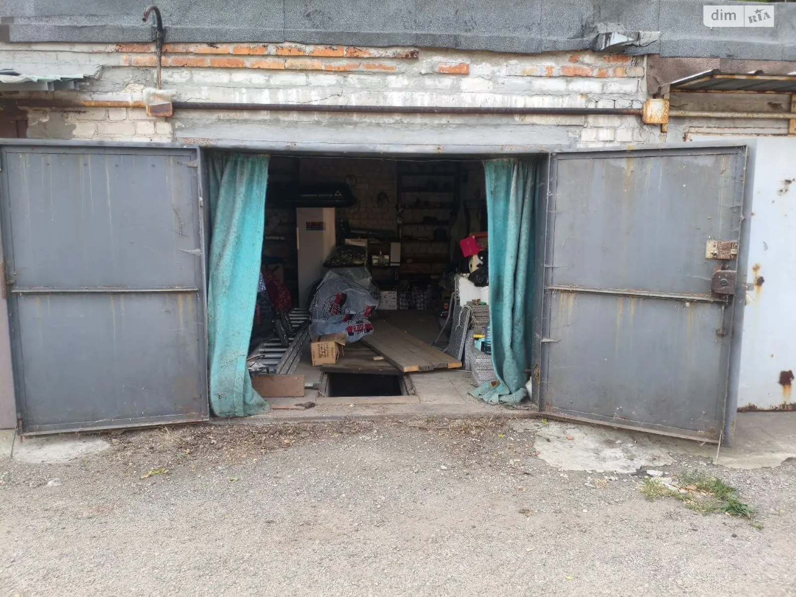 Продается место в гаражном кооперативе под легковое авто на 21 кв. м, цена: 5500 $ - фото 1
