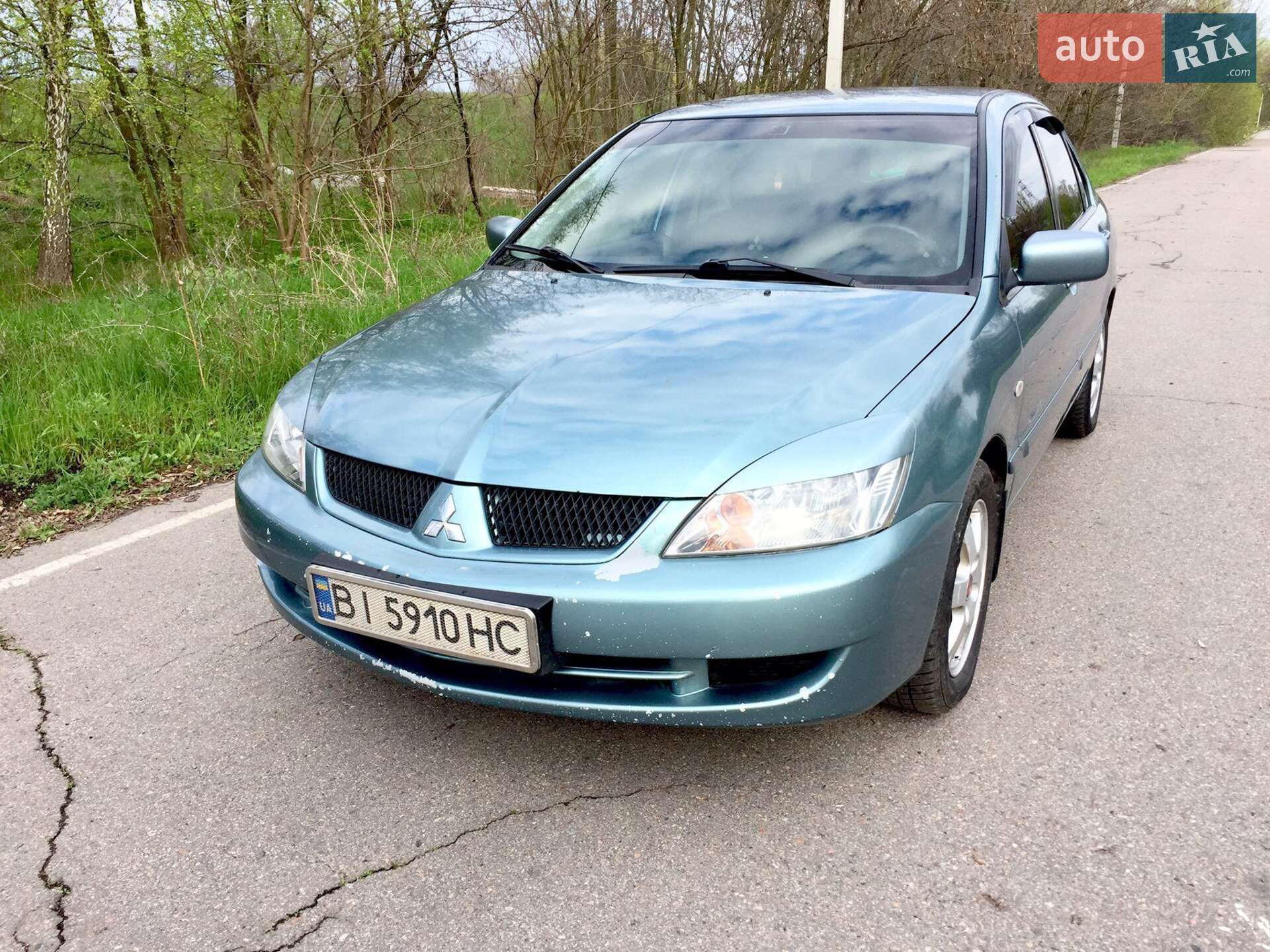 Головне фото звіту автомобіля MITSUBISHI LANCER 2006