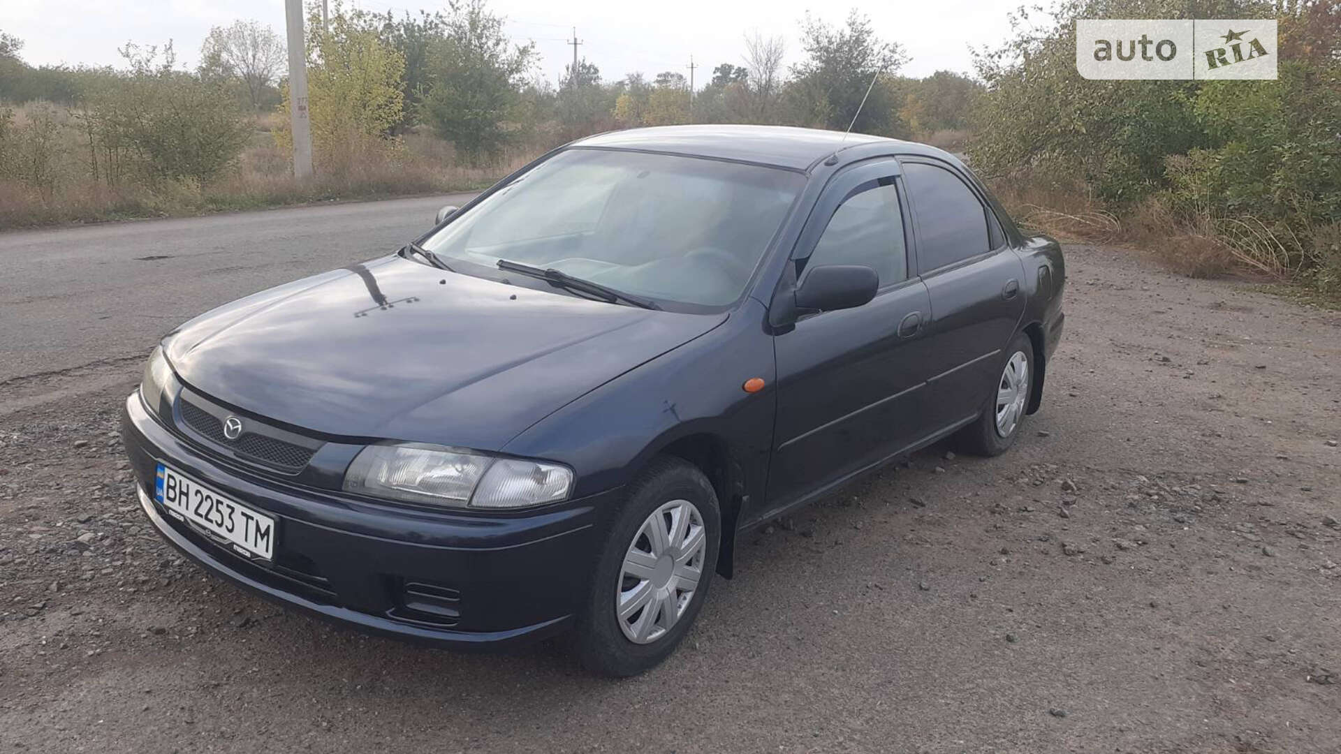 Головне фото звіту автомобіля MAZDA 323 1997