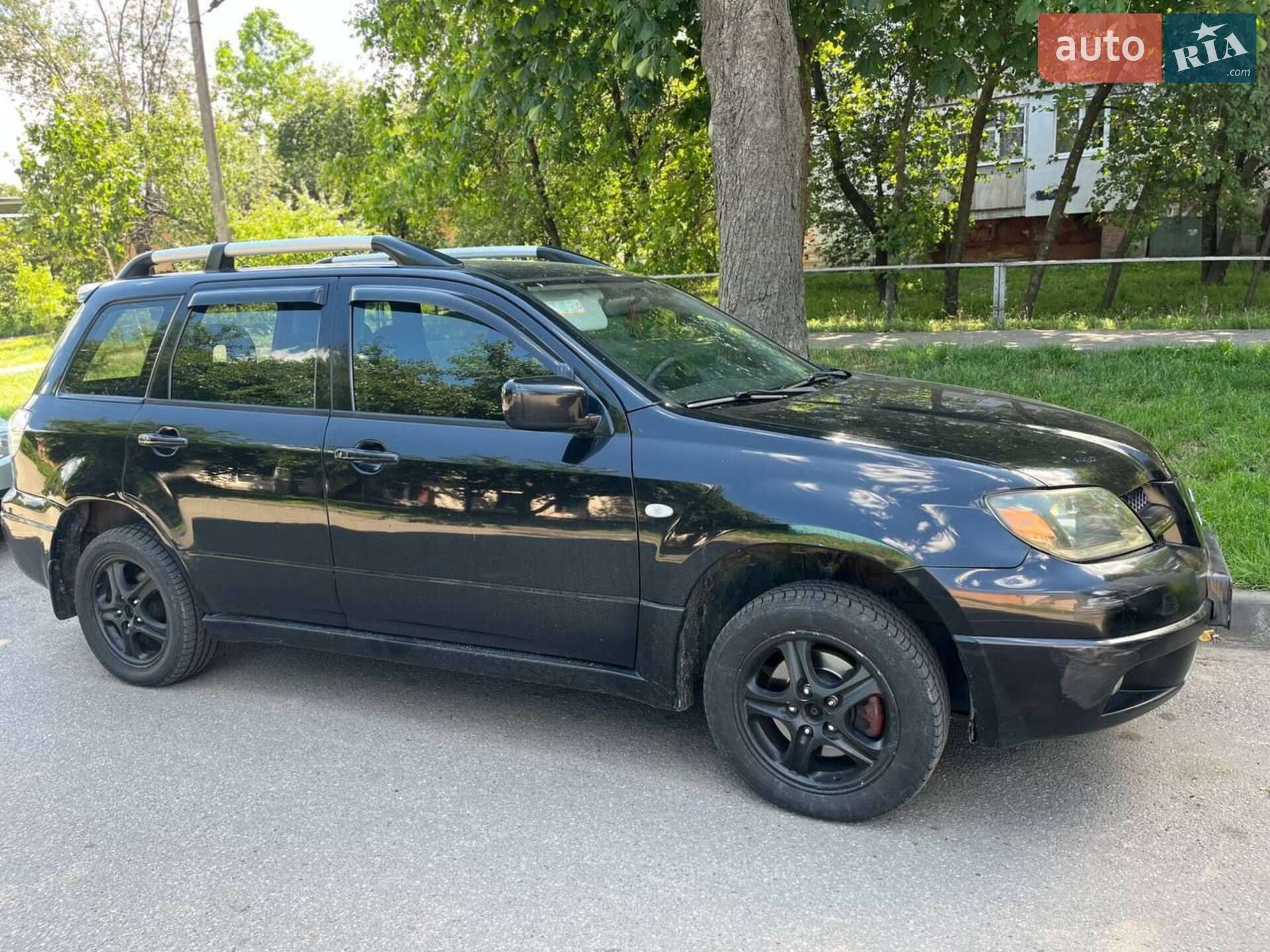 Головне фото звіту автомобіля MITSUBISHI OUTLANDER 2003