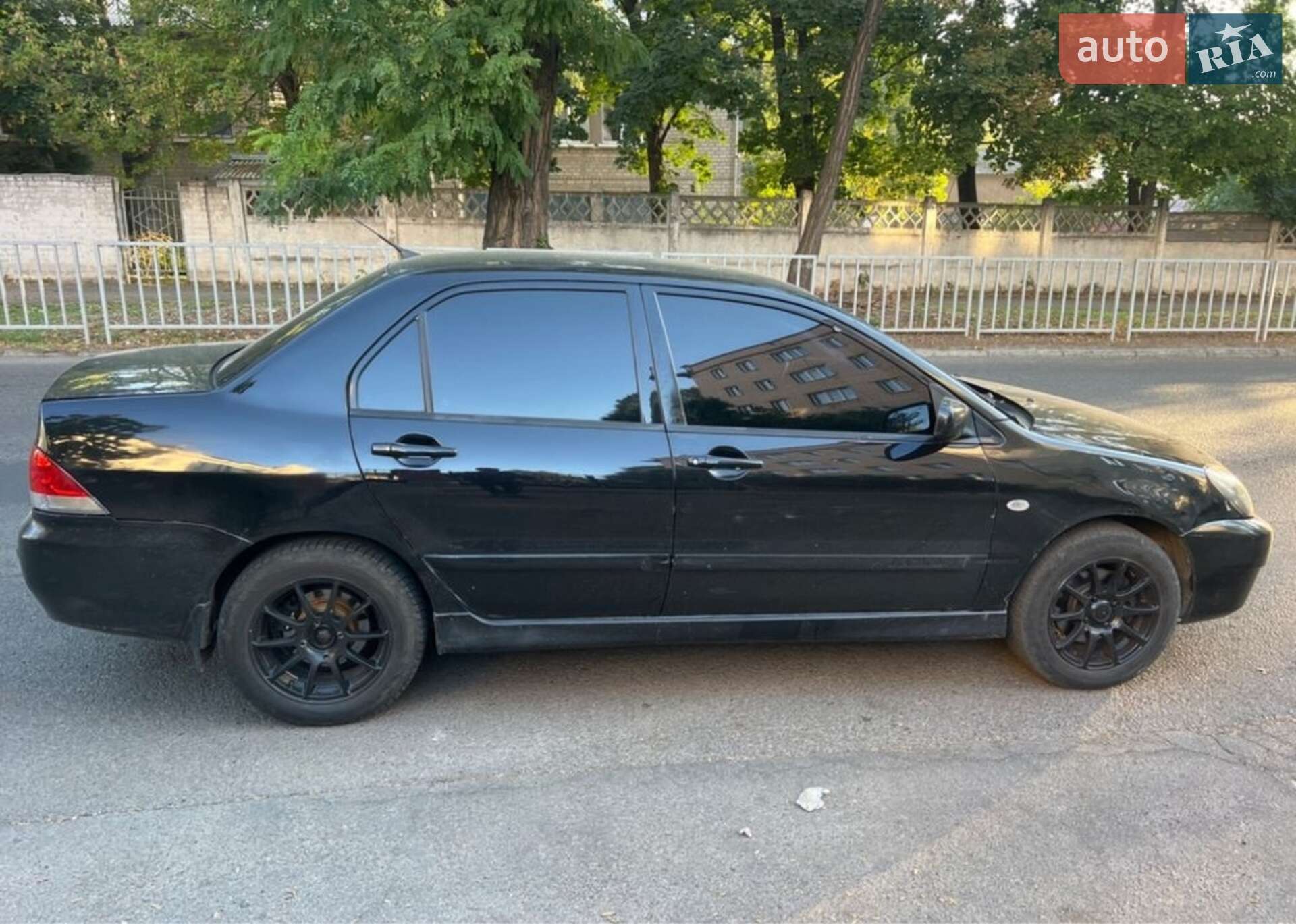 Головне фото звіту автомобіля MITSUBISHI LANCER 2006