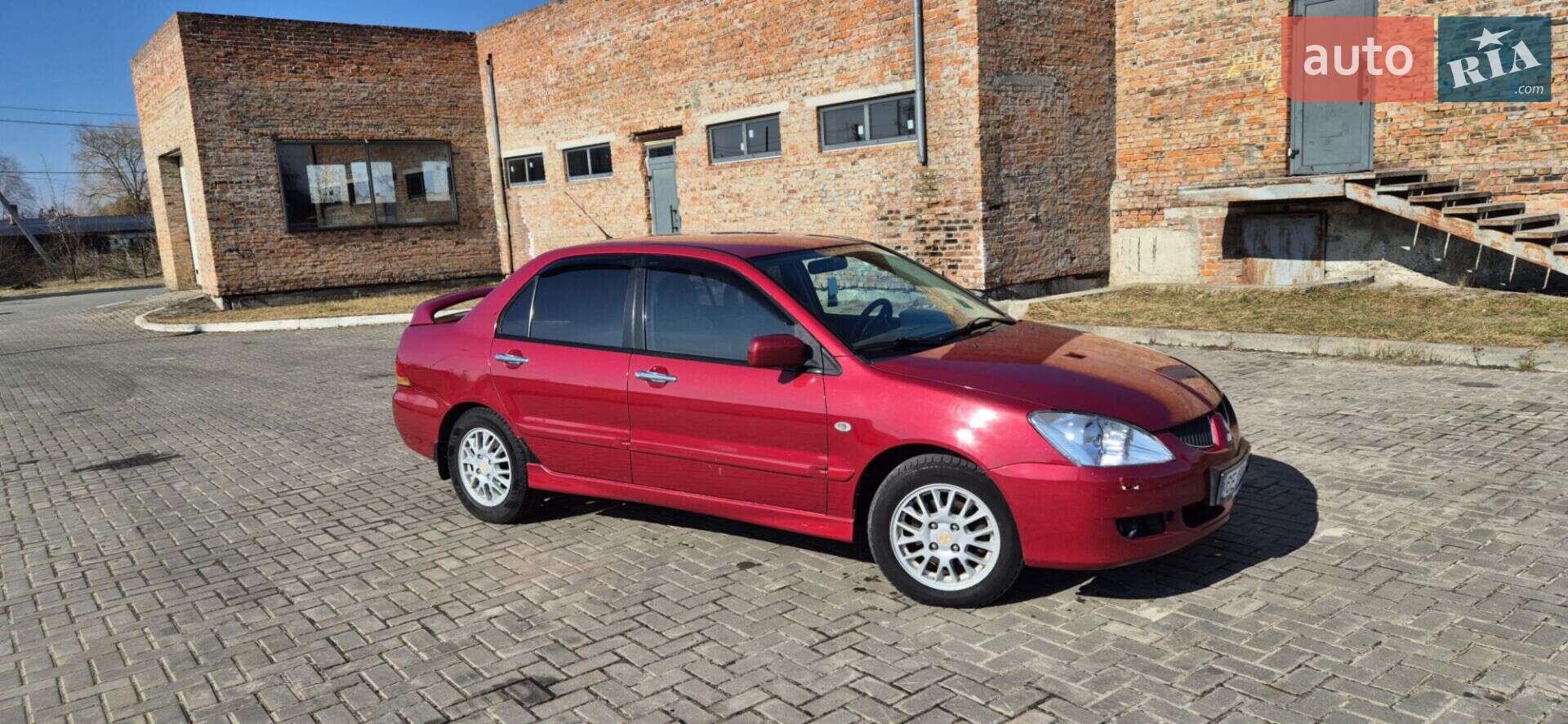 Головне фото звіту автомобіля MITSUBISHI LANCER 2005