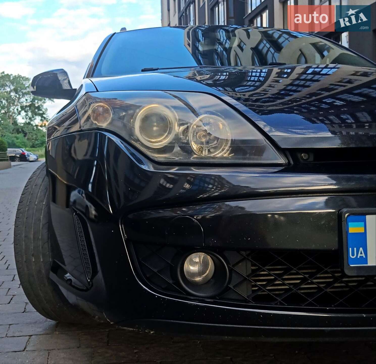Головне фото звіту автомобіля RENAULT LAGUNA 2010