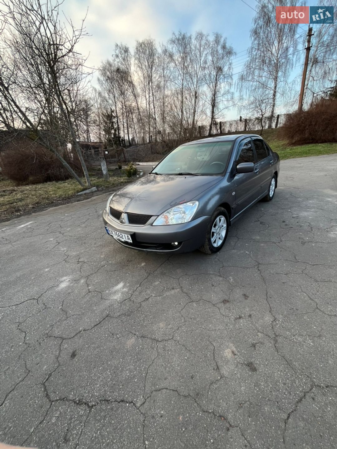 Головне фото звіту автомобіля MITSUBISHI LANCER 2005