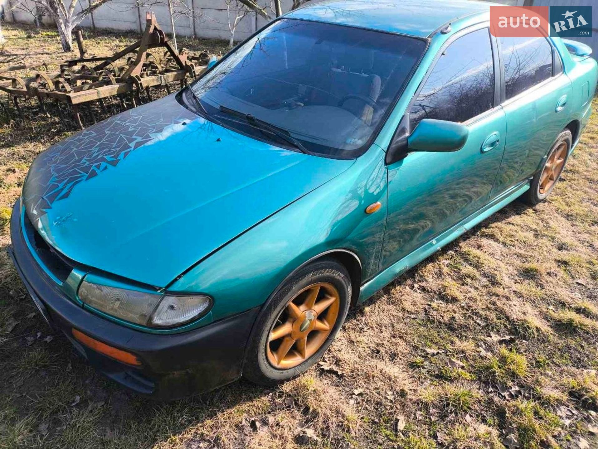 Головне фото звіту автомобіля MAZDA 323 1995