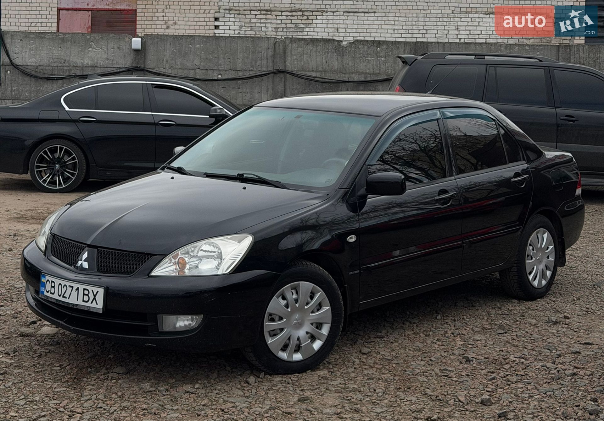 Головне фото звіту автомобіля MITSUBISHI LANCER 2009
