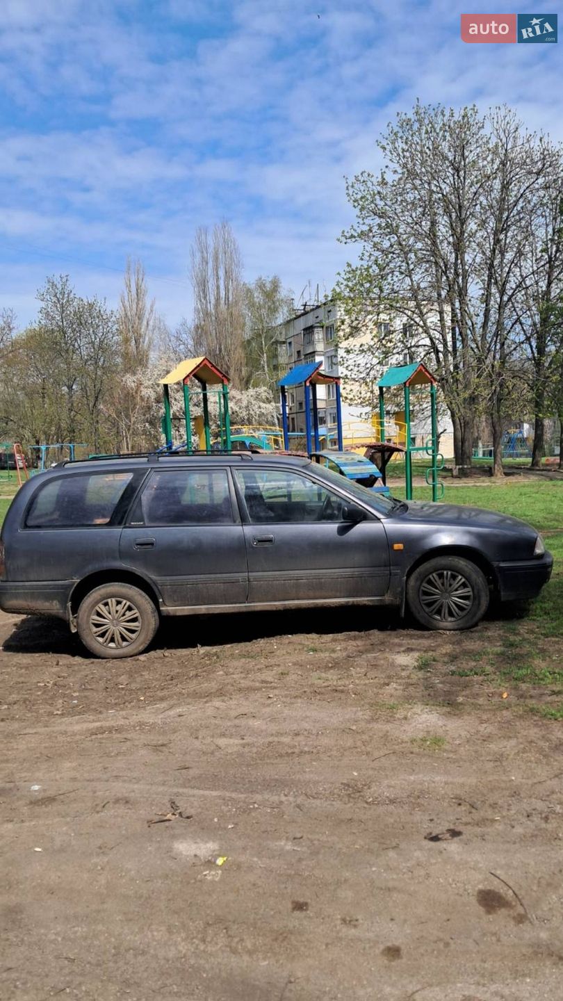 Головне фото звіту автомобіля NISSAN PRIMERA 1991