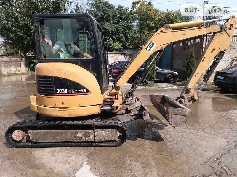 Екскаватор навантажувач Caterpillar 303