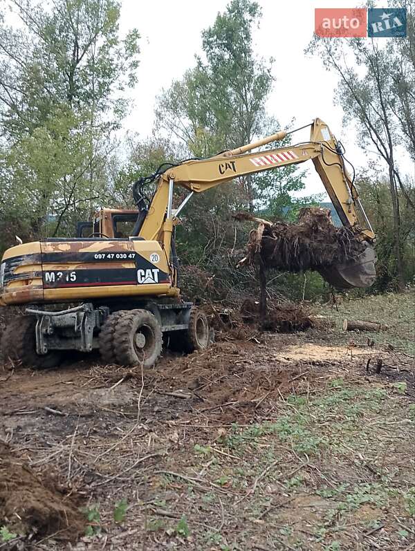 Екскаватор навантажувач Caterpillar 315