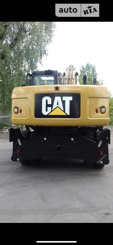 Экскаватор погрузчик Caterpillar 320