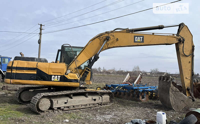 Екскаватор навантажувач Caterpillar 320