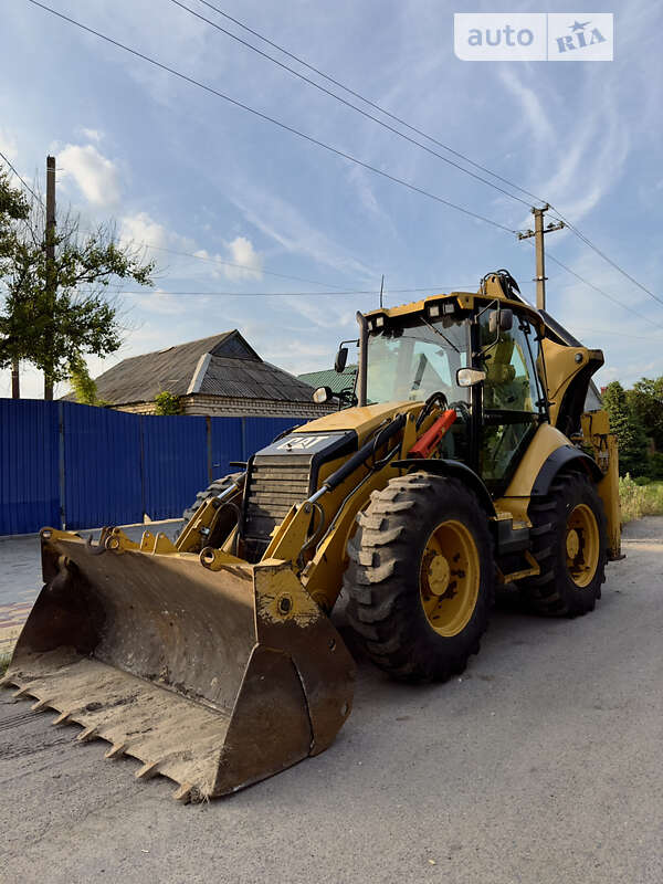 Экскаватор погрузчик Caterpillar 444