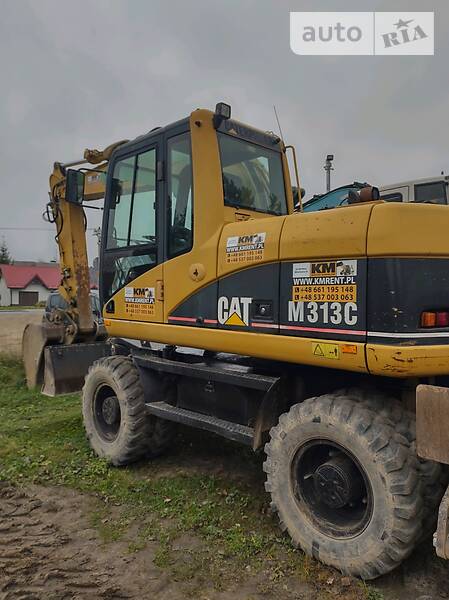 Колісний екскаватор Caterpillar M313