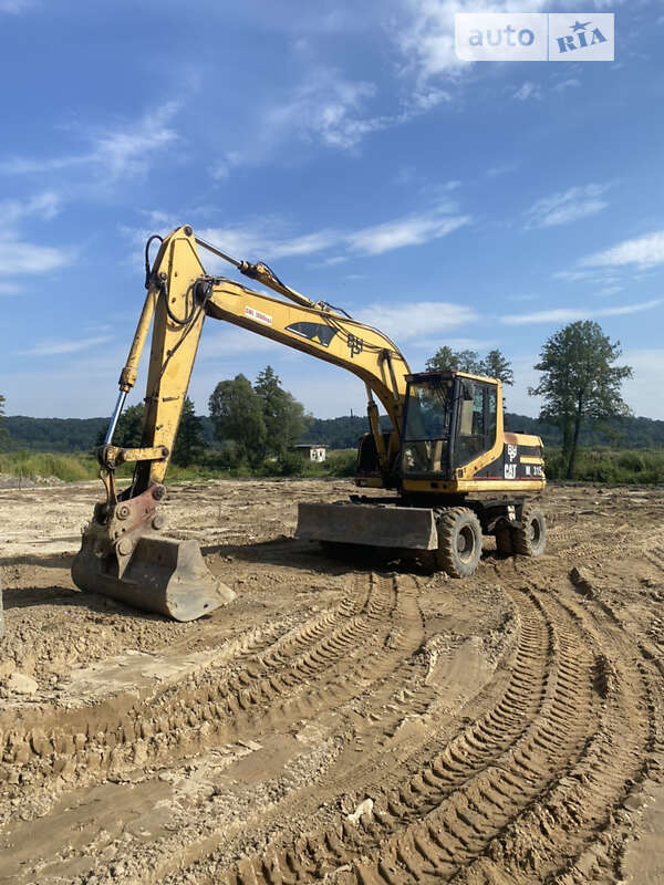 Экскаватор погрузчик Caterpillar M315