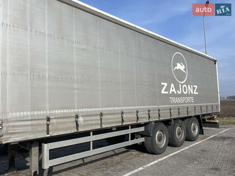 Тентований борт (штора) - прицеп Krone SD