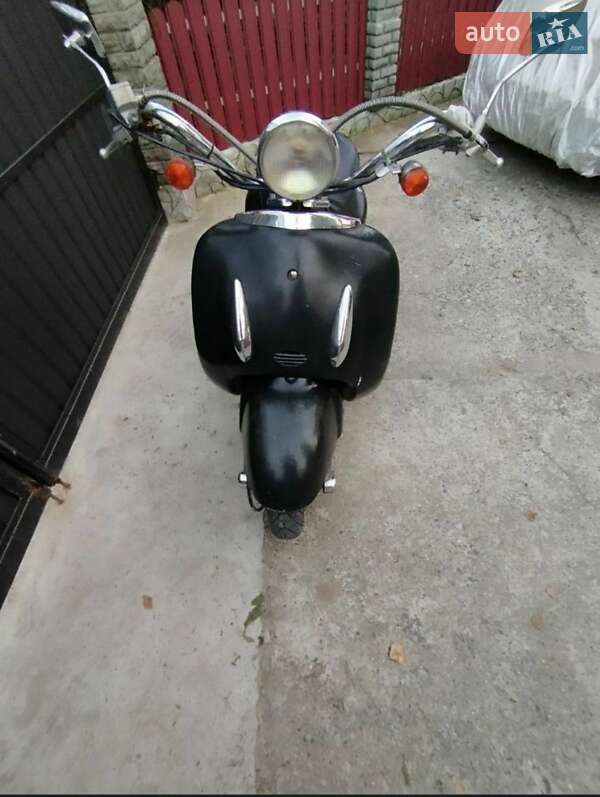 Скутери з кабіною