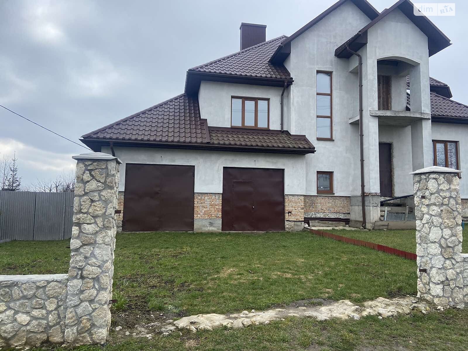 двухэтажный дом с гаражом, 230 кв. м, кирпич. Продажа в Байковцах фото 1