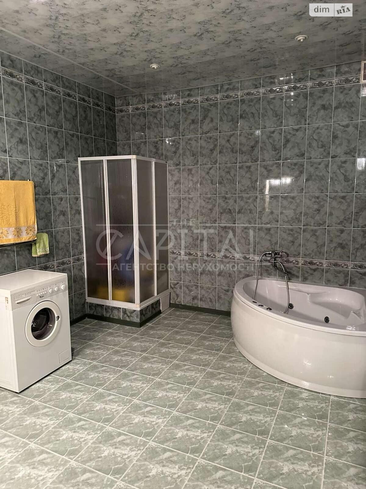 трехэтажный дом с верандой, 428.9 кв. м, кирпич. Продажа в Буче район Буча фото 1