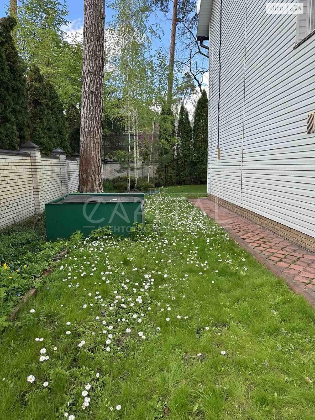 трехэтажный дом с верандой, 428.9 кв. м, кирпич. Продажа в Буче район Буча фото 1