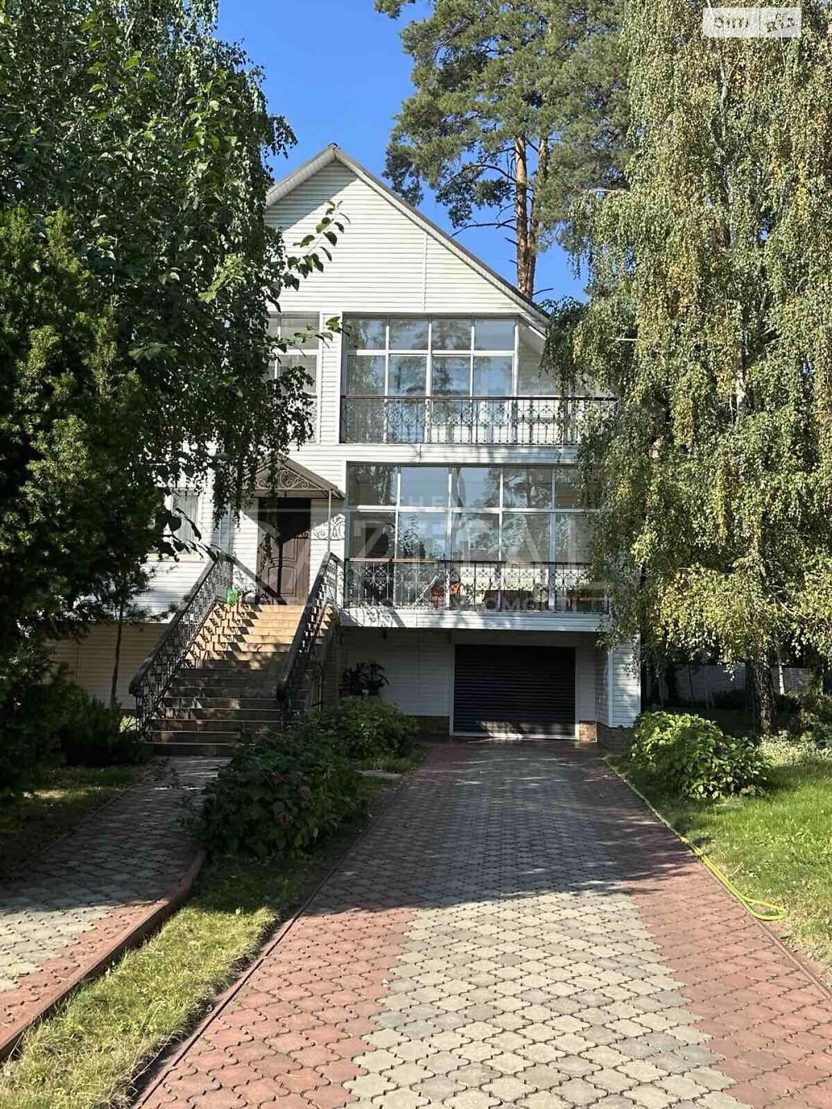 трехэтажный дом с верандой, 428.9 кв. м, кирпич. Продажа в Буче район Буча фото 1