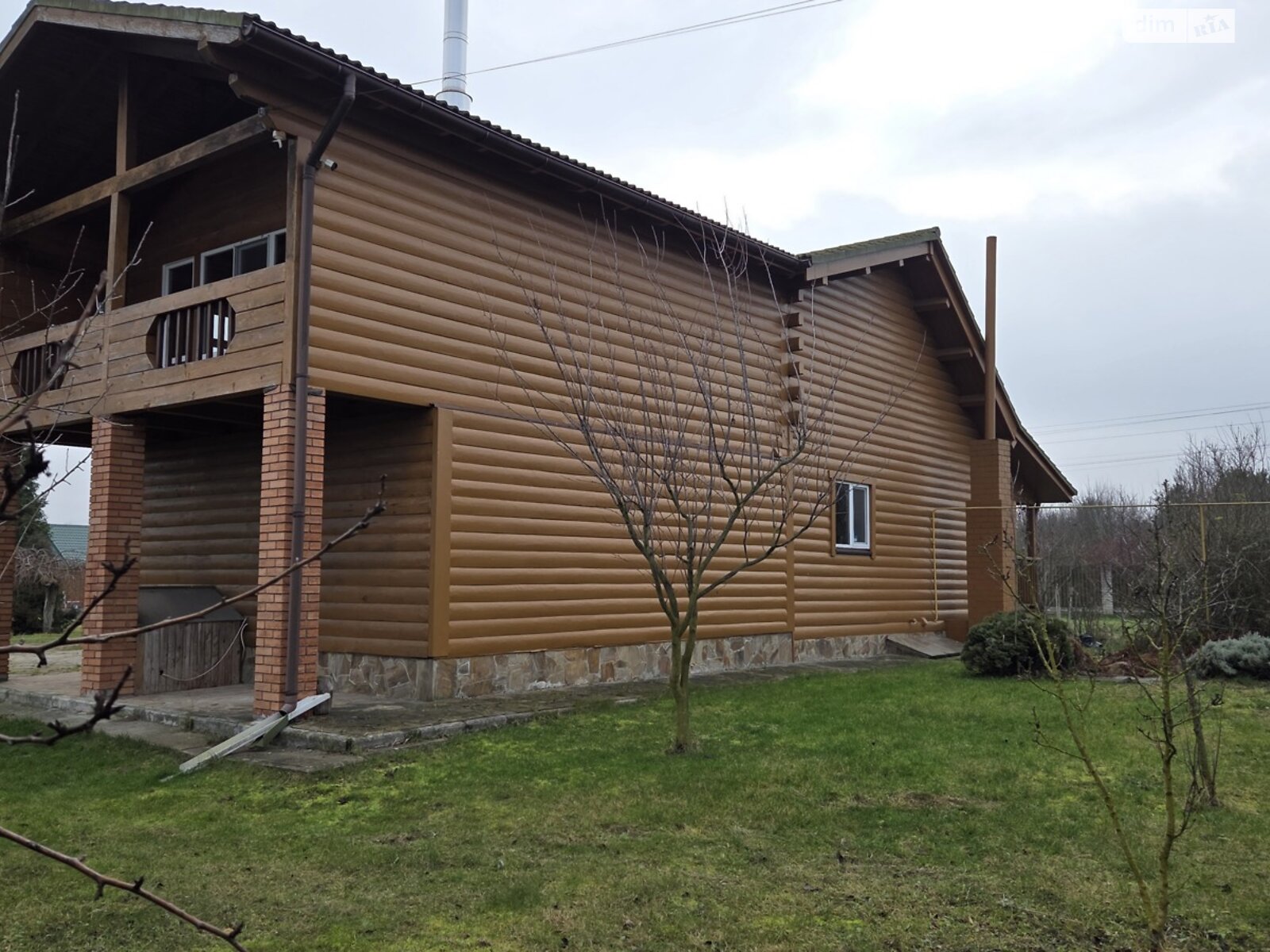 двухэтажный дом с гаражом, 320 кв. м, кирпич. Продажа в Осыковом фото 1