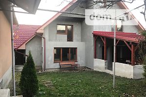 одноэтажный дом с гаражом, 240 кв. м, кирпич. Продажа в Цыгановцах фото 2