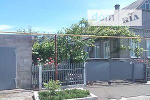 одноэтажный дом с гаражом, 100 кв. м, кирпич. Продажа в Волновахе фото 2