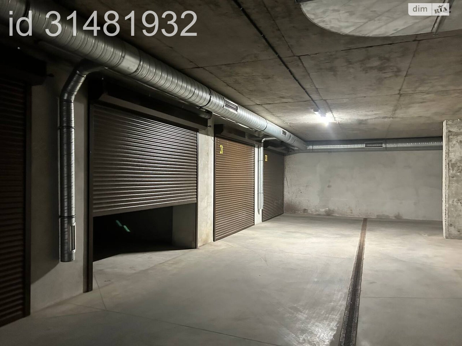 Место в подземном паркинге под легковое авто в Хмельницком, площадь 22.7 кв.м. фото 1