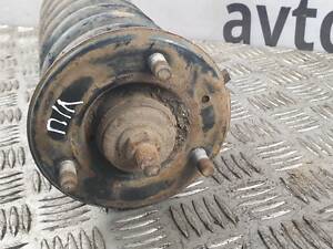 Амортизатор передний левый в сборе 56100EB39C Nissan Navara D40