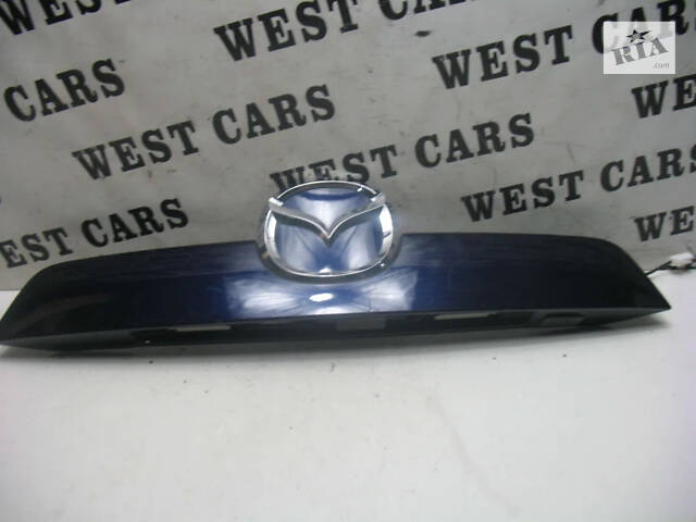 Б/в Накладка кришки багажника (панель підсвічування номера) на Mazda CX-5 2011-