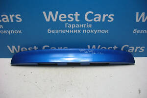 Б/в Накладка кришки багажника (панель підсвічування номера) на Nissan Note 2006-2012