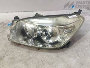 Фара левая линза электрокорректором -08 8117042311 TOYOTA RAV4 05-13