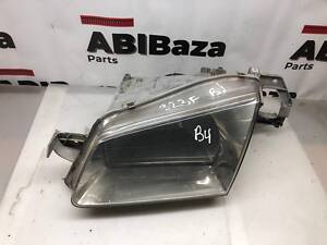 Фара ліва Mazda 323F 1998-2003 1305235392 /B4/