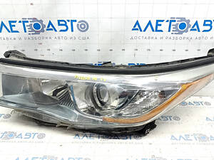 Фара передняя левая Toyota Highlander 14-16 голая, темная, галоген, песок, сломаны крепления, побит корпус