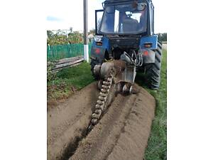 Копка траншей, траншейник, земляные работы, экскаватор траншейный цепной.