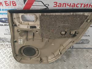 Панель обшивки задней двери левая 829018H801 Nissan X-Trail T30