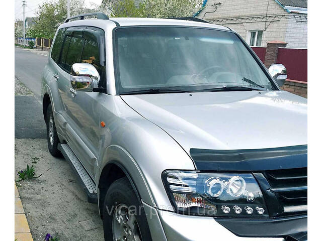 Передняя линзовая оптика, фары (черные) Mitsubishi Pajero Wagon III (2001-2006) - Фото 1