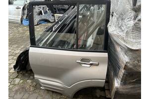 Стекло дверей задньої лівої для Mitsubishi Pajero Wagon 2001-2005 MR436983