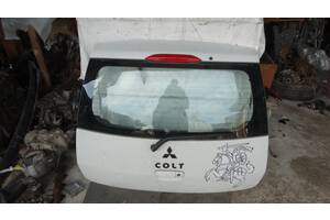 Вживана кришка багажника для Mitsubishi Colt 2003, 2008 Кришка багажника під покраску ціна за комплектну.