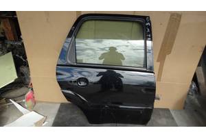 Вживані двері задні для Mazda Tribute 2001-2008 Під покраску сторона права ціна за голу дверку.