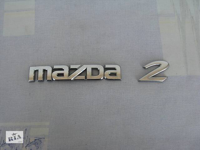 Емблема для Mazda 2