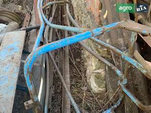 Направляюча драбинка приспособа подачі тюків