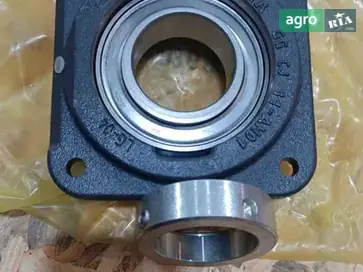Корпус підшипника AZ100256 до комбайна John Deere - фото