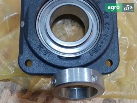 Корпус підшипника AZ100256 до комбайна John Deere - фото