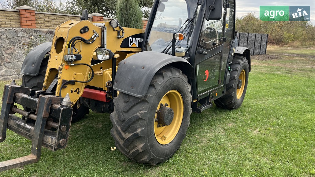 Навантажувач Caterpillar CAT 2009 - фото 1