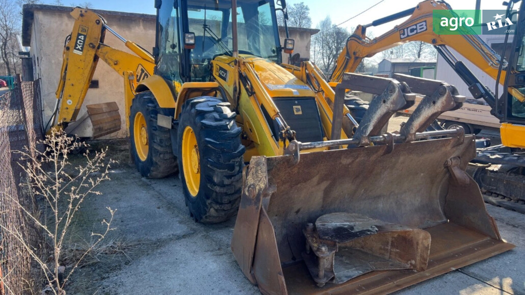 Погрузчик JCB 4CX 2004 - фото 1