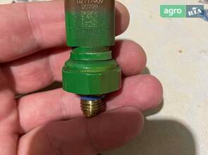 John Deere. Датчик тиску мастила двигуна.