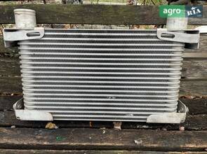 Теплообмінник John Deere з каталожним номером AL218982.