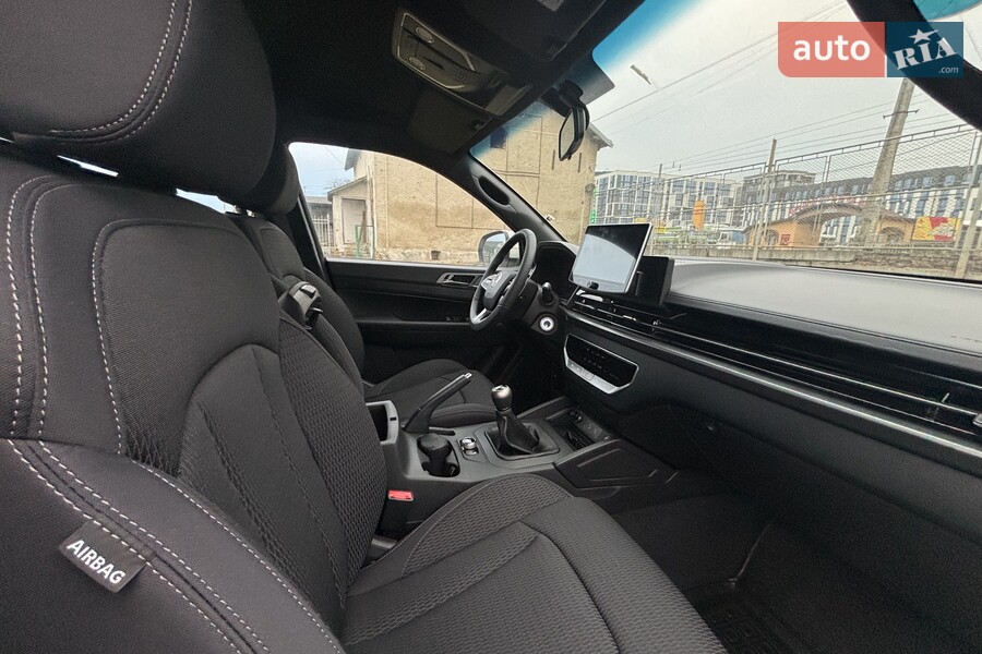 KG Mobility Grand Musso - фото 12