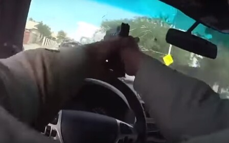Видео: полицейский стрелял по беглецам прямо сквозь свое лобовое стекло